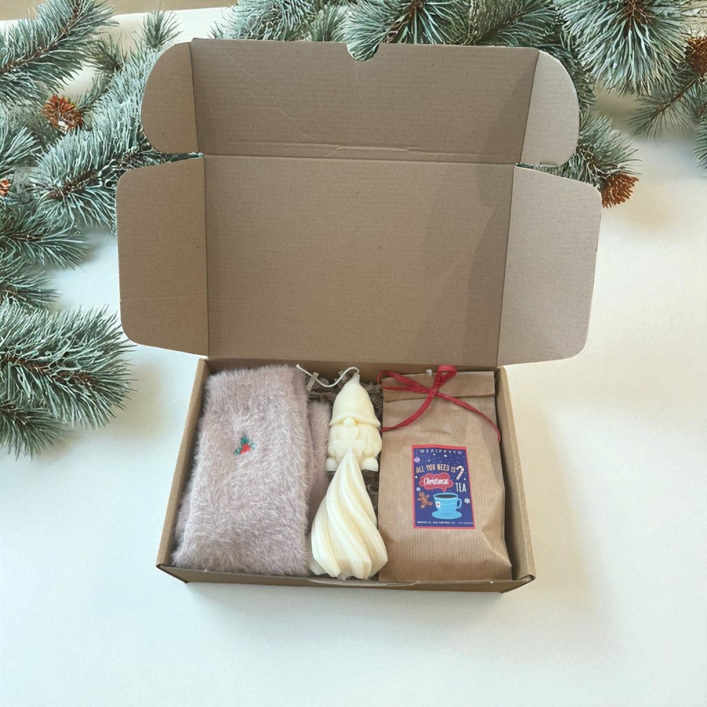 Christmas gift boxes with various handmade items.