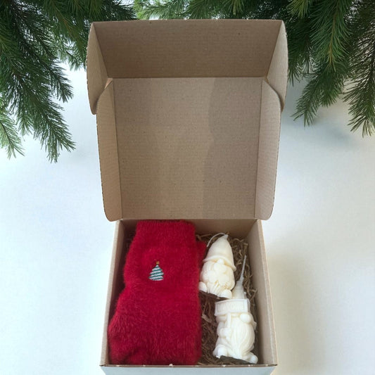 Christmas gift boxes with socks and handmade candles.
