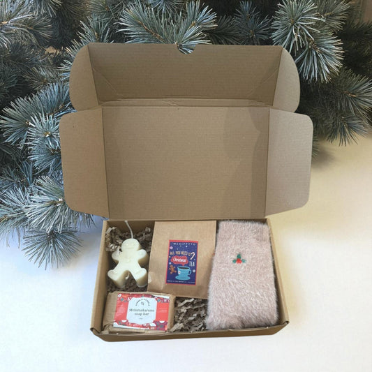 Christmas gift boxes with various handmade items.