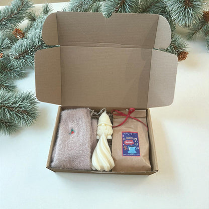 Christmas gift boxes with various handmade items.