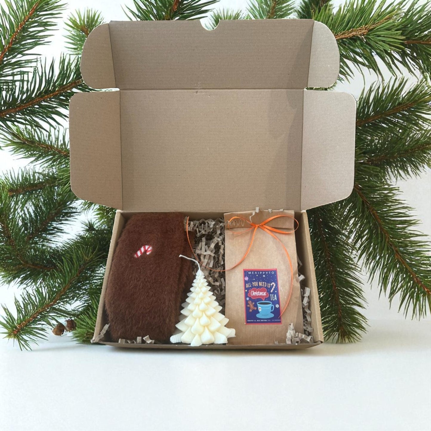 Christmas gift boxes with various handmade items.
