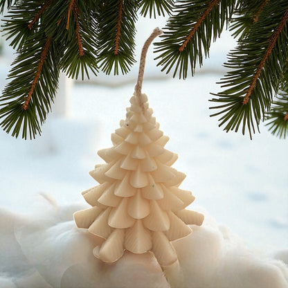 Handmade coconut wax candle in a Christmas tree design.